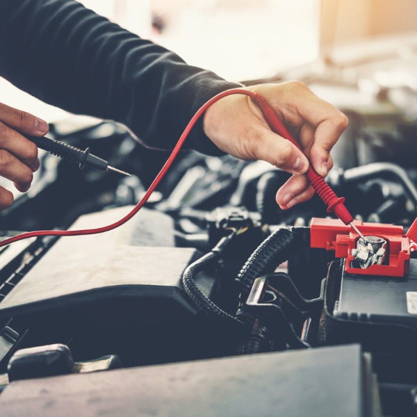 technician hands of car mechanic working in auto repair service